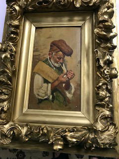 Man Lighting Pipe, unsigned, in frame, private collection
